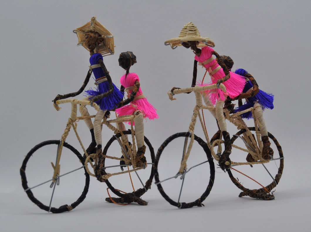 Figures on a bicyle